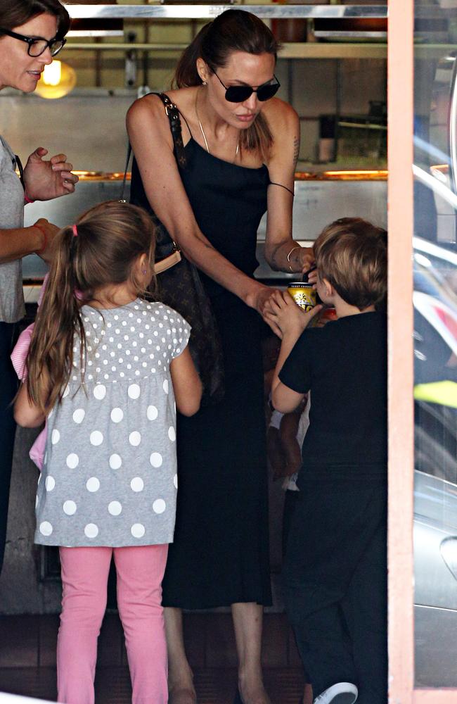 Family time ... Angelina Jolie and kids on a shopping trip in Sydney during her stay here to direct the film Unbroken.