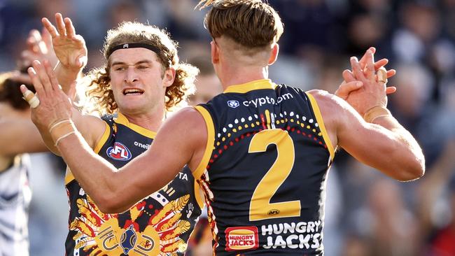 Sam Berry and Ben Keays celebrate a goal.