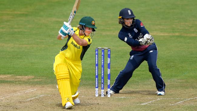 England keeper Sarah Taylor looks on as Australia’s Beth Mooney hits out during the ICC Women's World Cup. Picture: Stu Forster/Getty Images