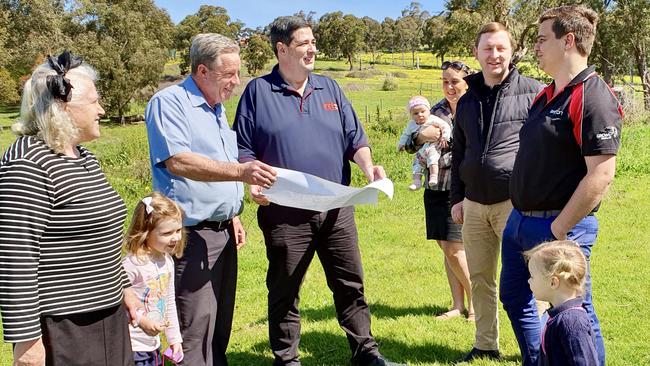 Plymouth Brethren Christian Church’s Lance Nipper discusses the Lysterfield plans with members of the church community.