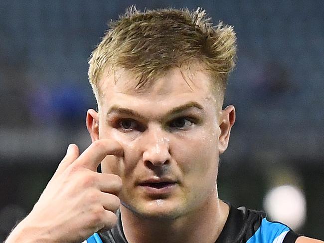 MELBOURNE, AUSTRALIA - AUGUST 17: Ollie Wines and his Power team mates look dejected after losing the round 22 AFL match between the North Melbourne Kangaroos and the Port Adelaide Power at Marvel Stadium on August 17, 2019 in Melbourne, Australia. (Photo by Quinn Rooney/Getty Images)