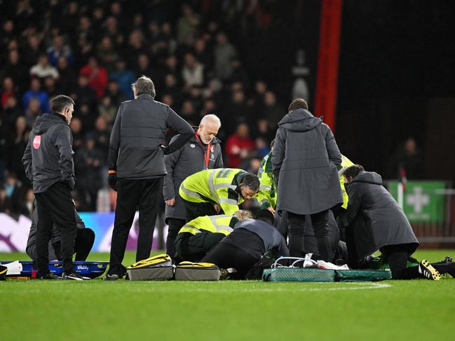 BOURNEMOUTH, ENGLAND - DECEMBER 16: Tom Lockyer of Luton Town (obscured) receives medical treatment after collapsing during the Premier League match between AFC Bournemouth and Luton Town at Vitality Stadium on December 16, 2023 in Bournemouth, England. (Photo by Mike Hewitt/Getty Images)