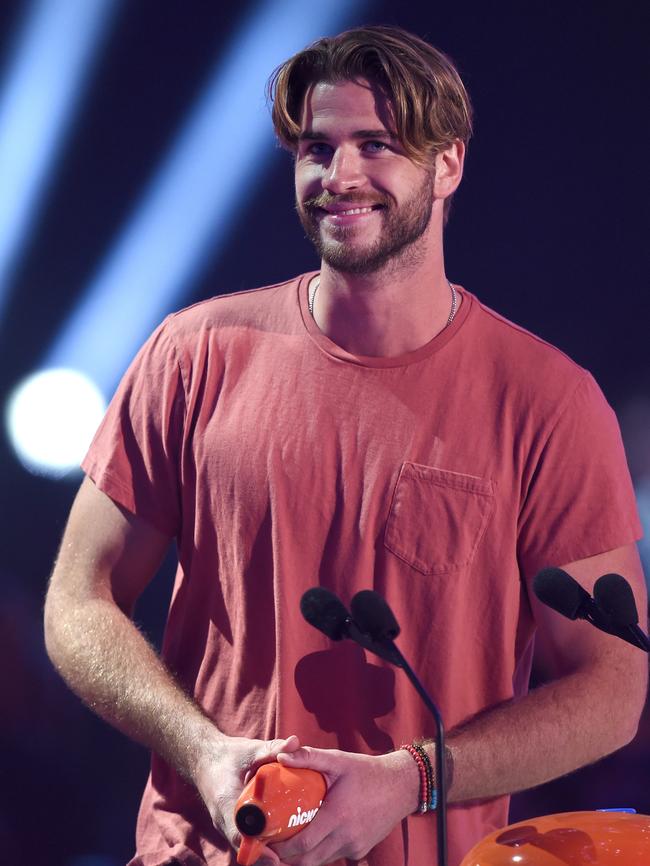 Liam Hemsworth accepts award for Favorite Male Action Star.