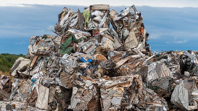 Crushing of metal waste extracted from landfill as part of City of Darwin's new contract with Veolia. Picture: Che Chorley