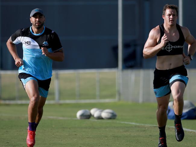 Cronulla Sharks latest recruit Josh Morris pictured at his first training session for his new club at Shark Park in Woolooware. Josh (R) runs alongside the Sharks other new recruit Shaun Johnson. Picture: Toby Zerna