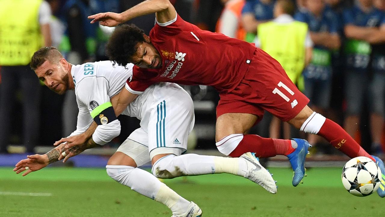 Mohamed Salah is brought crashing down by Sergio Ramos.