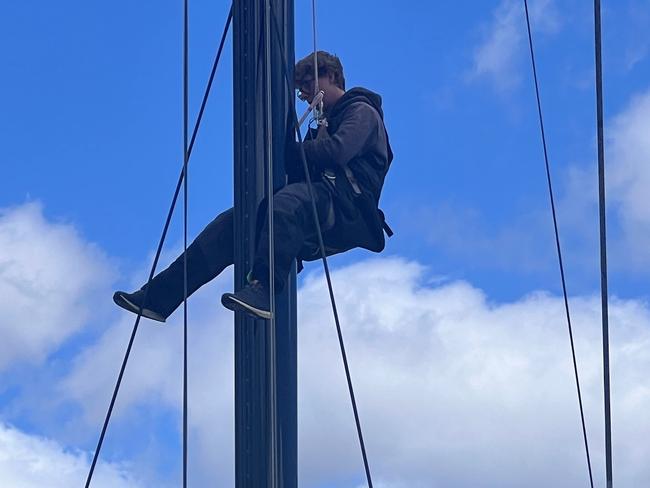 Charlie Goodfellow checking the mast in Hobart. Picture supplied: Deborah Wallace