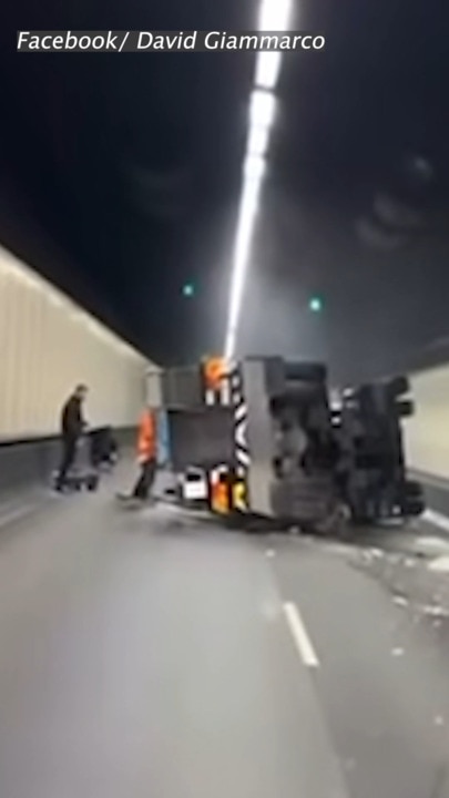 Watch: Moment crane swerves then flips on busy motorway