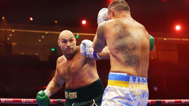 Tyson Fury punches Oleksandr Usyk. Photo by Richard Pelham/Getty Images.