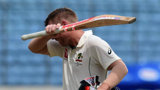 Done and dusted: David Warner’s ton can’t stop a drubbing by minnows Bangladesh. Picture: AFP