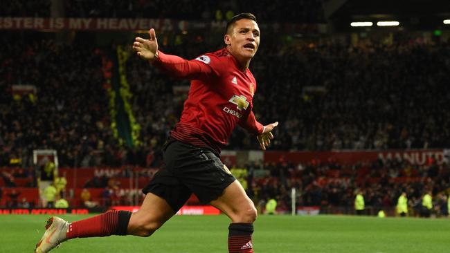 Sanchez celebrates his goal against Newcastle. (Photo by Oli SCARFF / AFP) /