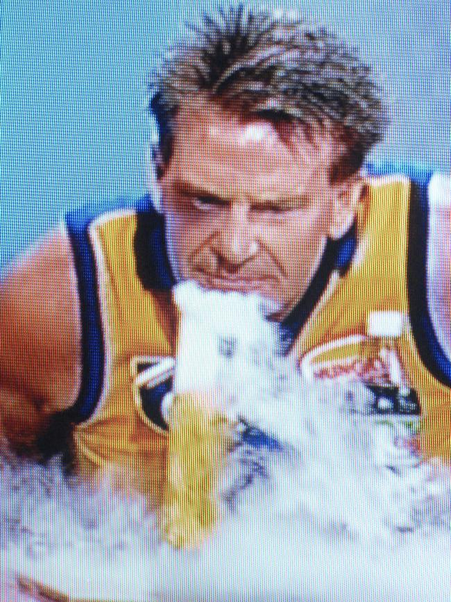 Sam Newman pretends to smoke a bong.