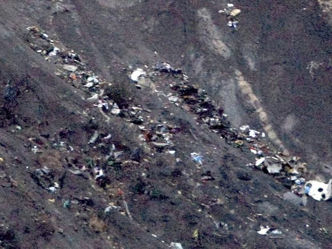 Debris of the Germanwings passenger jet is scattered on the mountain side near Seyne less Alpes, French Alps. Pic: Claude Paris