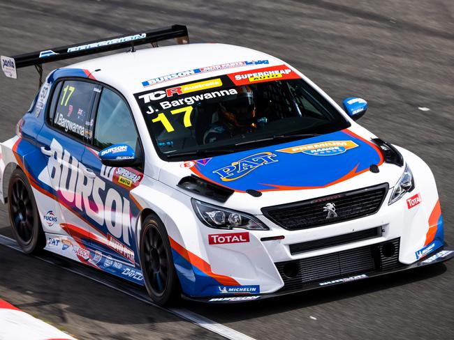 Former Bathurst 1000 champion Jason Bargwanna racing his Peugeot TCR race car at Symmons Plains.