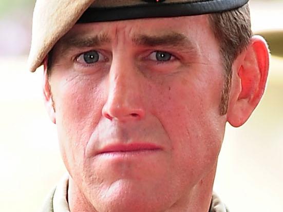 Australian Army soldier Corporal Benjamin Roberts-Smith, VC, MG, takes a seat after being awarded the Victoria Cross for Australia during the investiture ceremony in Perth on 23 January 2011. *** Local Caption *** The Governor-General of the Commonwealth of Australia held an investiture ceremony at Campbell Barracks in Perth to award a Victoria Cross for Australia to Corporal Benjamin Roberts-Smith, VC, MG, on 23 January 2011.  Corporal Benjamin Roberts-Smith, VC, MG, from the Special Air Service Regiment was awarded the Victoria Cross for Australia for his gallantry under fire during operations in Afghanistan in June 2010.    Present at the ceremony were the Governor-General of the Commonwealth of Australia, Her Excellency Ms Quentin Bryce AC; Prime Minister of Australia the Hon. Julia Gillard MP; Leader of the Opposition the Hon. Tony Abbott MP; Minister for Defence the Hon. Stephen Smith MP; Minister for Defence Science and Personnel the Hon Warren Snowdon MP; Governor of Western Australia, His Excellency Dr Ken Michael AC; Premier of Western Australia the Hon. Colin Barnett MLA; Ambassador of the Islamic Republic of Afghanistan, his Excellency Dr Amanullah Jayhoon; Member for Curtin the Hon. Julie Bishop MP; Chief of the Defence Force, Air Chief Marshal Angus Houston AC AFC; Chief of Army, Lieutenant General Ken Gillespie AO DSC CSM; and Special Operations Commander Australia, Major General Gus Gilmore DSC.  The Victoria Cross for Australia is our highest honour. It is only awarded to those who display the most conspicuous gallantry and daring in the face of the enemy. Corporal Benjamin Roberts-Smith, VC, MG, becomes the 98th Australian recipient of the award and the second recipient of the Victoria Cross for Australia since it was instituted in 1991. Picture: Department of Defence