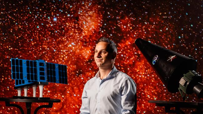 Enrico Palermo, head of the Australian Space Agency, with a satellite at the Lab. Picture: Matt Turner.