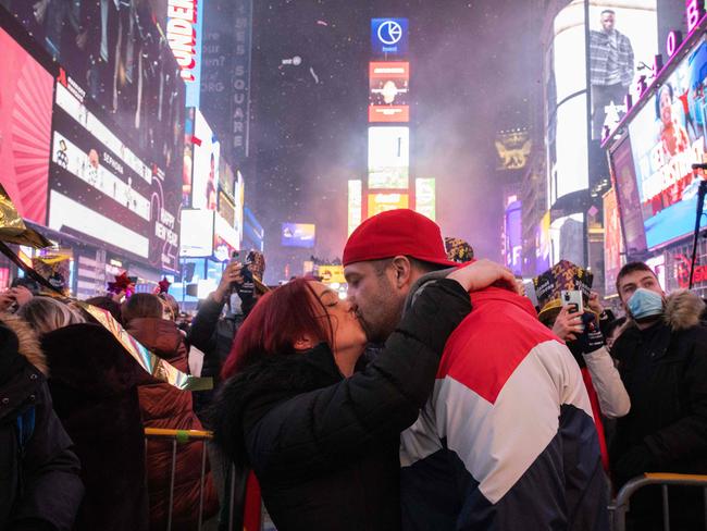 A couple kisses as they celebrate the New Year at Times Square in New York City in January 1, 2022. Picture: AFP