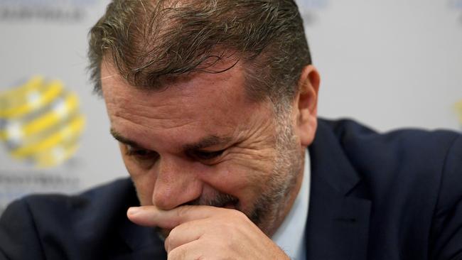 Socceroos head coach Ange Postecoglou holds back tears as he announces his resignation as Socceroos coach. Photo: AAP