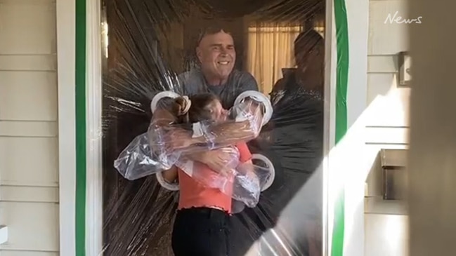 Girl makes 'hug curtain' to hug grandparents