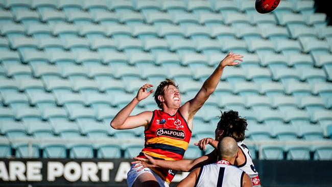 Keiran Strachan rucked for the Crows in the warm-up game at Alberton Oval. Picture: Mike Burton