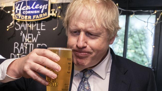 Johnson takes a sip from a pint of Rattler cider in 2019. Picture: AFP