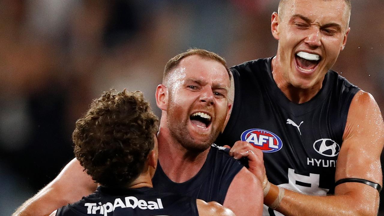 Sam Docherty celebrates a goal with Charlie Curnow and Patrick Cripps against Richmond in the opening round. Picture: Dylan Burns/AFL Photos via Getty Images