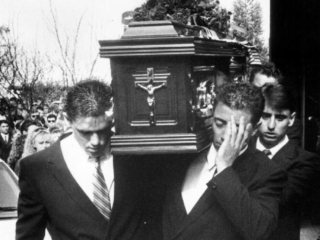 Fittler (left) and Alexander’s brother Greg (hand across face) help carry the coffin at Ben Alexander’s funeral.