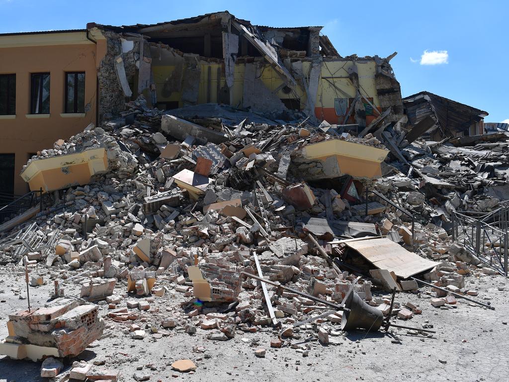 AMATRICE, ITALY - AUGUST 25: A partially collapsed school that was built after the introduction of anti-earthquake construction legislation is surrounded by rubble on August 25, 2016 in Amatrice, Italy. The death toll in the 6.2 magnitude earthquake that struck around the Umbria region of Italy in the early hours of Wednesday morning has risen to at least 247 as thousands of rescuers continue to search for survivors. (Photo by Carl Court/Getty Images)