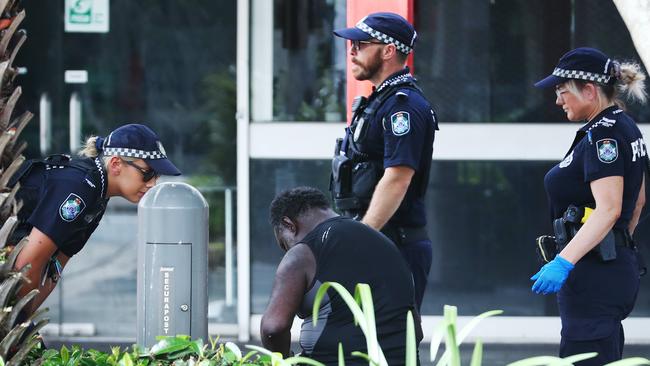 Police officers assist a heavily intoxicated man in the Shields Street Mall. Picture: Brendan Radke