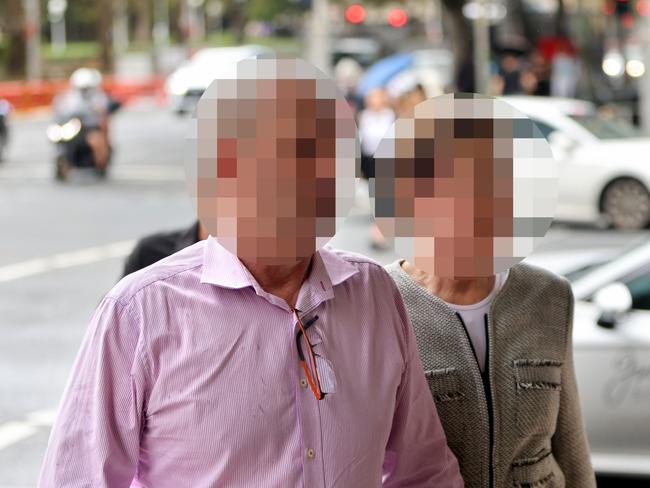 SYDNEY, AUSTRALIA - NewsWire Photos MARCH 22, 2024: *** CANNOT BE IDENTIFIED, SUPPRESSION ORDERS IN PLACE, MUST PIXELATE FACES*** William Tyrrell's foster parents pictured as they arrive at Downing Centre courts, Sydney CBD. William Tyrrell's foster parents have been charged with dummy bidding and assaulting a child who is not William.Picture: NCA NewsWire / Damian Shaw