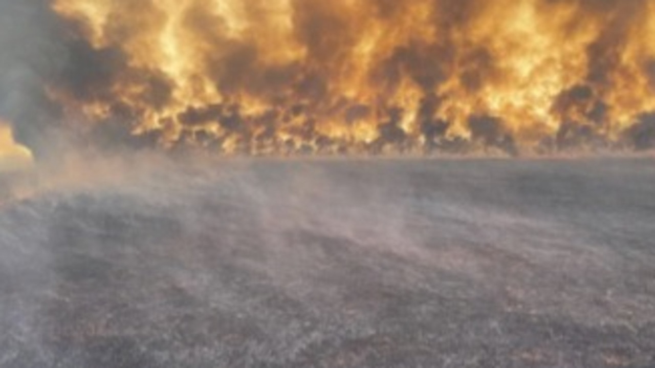 A bushfire threatens Tennant Creek in 2023, as extreme weather conditions continue to hinder firefighters' efforts to control the blaze. Picture: Bushfires NT