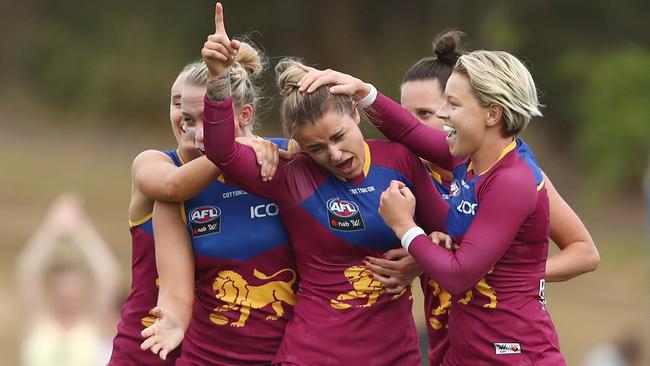 Jess Wuetschner celebrates a goal with teammates.