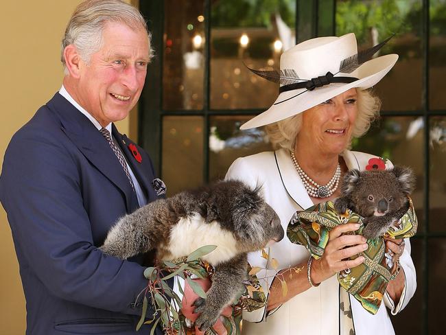 The Prince of Wales and Duchess of Cornwall holding koalas in 2012. Picture: AAP Image/Morne de Klerk