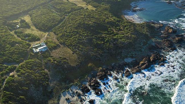 Looking down on the five-bedroom house with coastal frontage at 598 South Road, Nugara, on King Island. The landscape is home to wallabies, echidnas, ducks, turkeys and native bird species as well as peacocks, quail and pheasants.