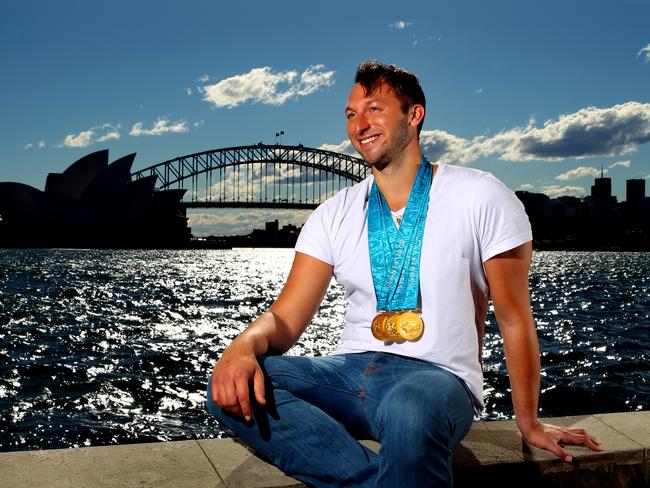 Swimmer Ian Thorpe with the three gold medals he won at the Sydney 2000 Olympic Games, pictured near Sydney Harbour, 10 years on from the Sydney Olympics.