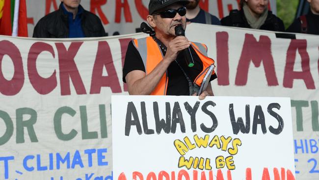 An activist speaks on the steps of MCEC. Picture: Andrew Henshaw