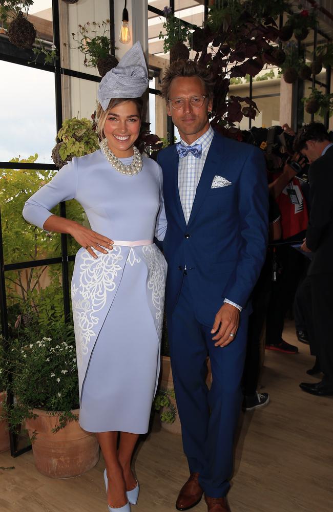 Ashley Hart and Buck Palmer in the Birdcage at the 2014 Melbourne Cup. Picture: Alex Coppel.