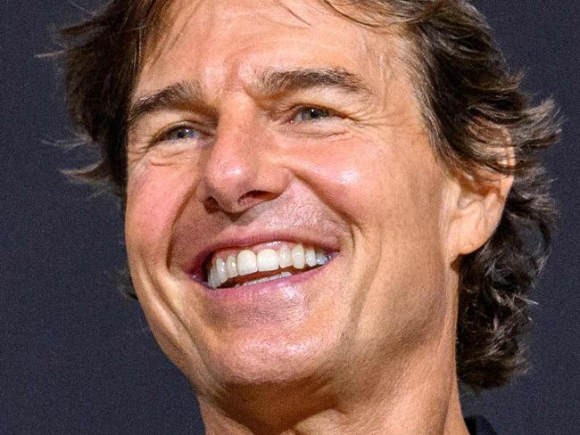 US actor Tom Cruise smiles during a press conference for the film 'Top Gun: Maverick' in Seoul on June 20, 2022. (Photo by ANTHONY WALLACE / AFP)