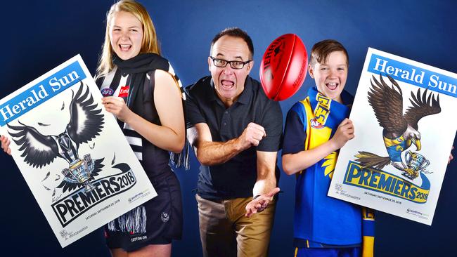 Triple M’s Hot Breakfast competition winners Portia Ronsberg, of Black Rock, and Mitchell Pittaway, of Taylors Lakes, helped launch the 2018 AFL Premiershop Posters with cartoonist Mark Knight. Picture: Nicki Connolly