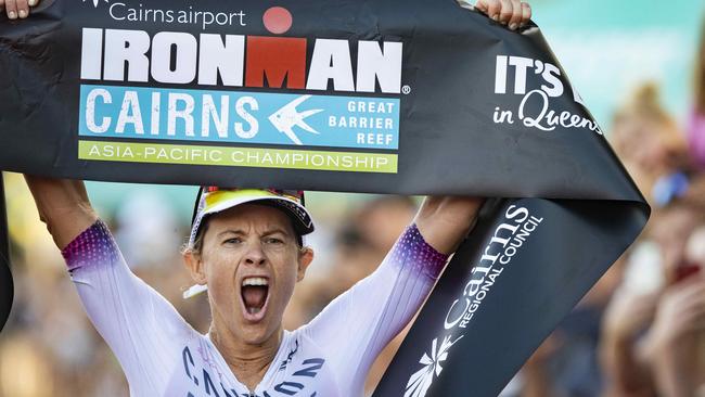 Cairns Ironman women's Pro Winner Sarah Crowley ecstatic as he crosses the finish line e. Picture: Brian Cassey