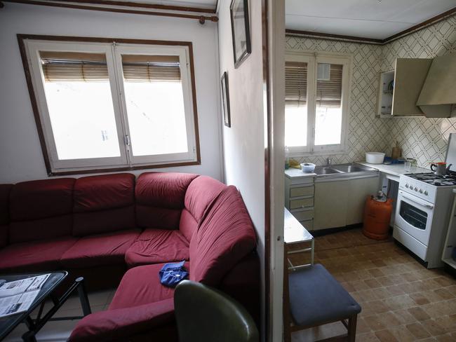 The kitchen and living room of the home, after police officers carried out a search. Picture: AFP