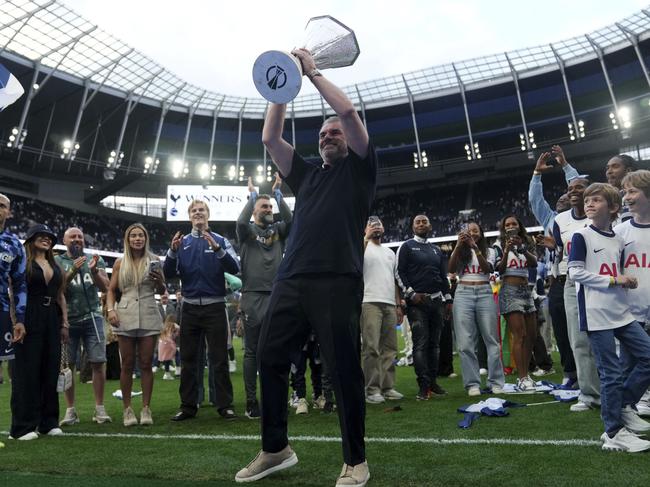 Ange Postecoglou holds the Europa League trophy aloft in front of Tottenham faithful. Picture: John Walton/PA