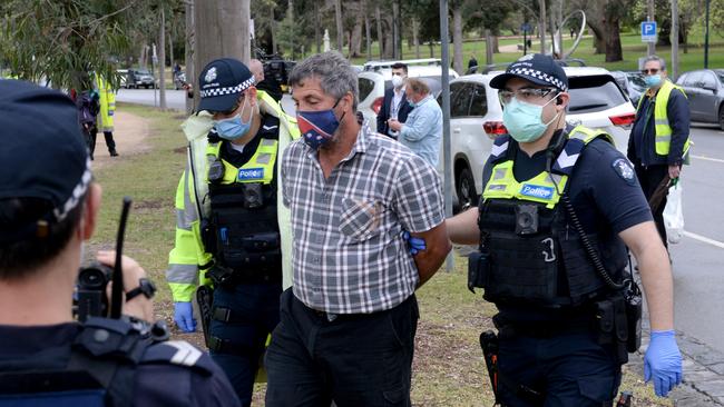 Police arrest another demonstrator at the anti-lockdown protest Picture: Andrew Henshaw