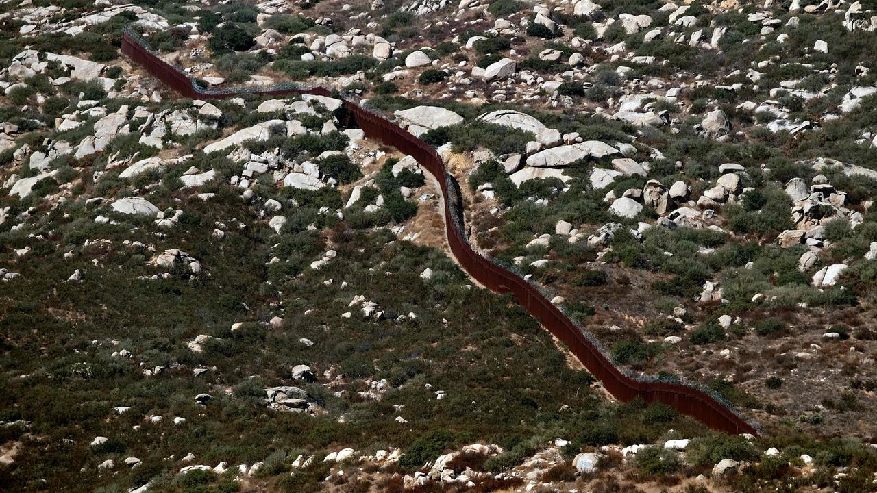 Aerial view of a section of the US-Mexico border fence. Picture: Guillermo Arias / AFP