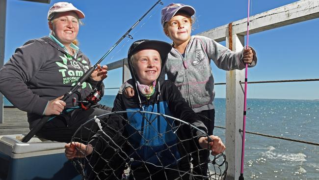 Salisbury East woman Rebecca Gay, with children Devin, 9, and Dimitroula, 6, go fishing at Largs Bay jetty. Picture: Tom Huntley