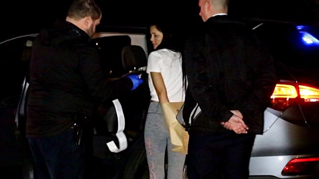 Kristen Moriarty is arrested by police after the alleged home invasion. Picture: Bill Hearne