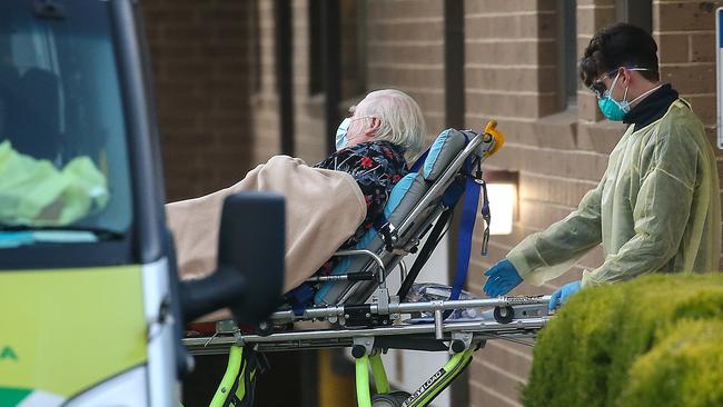 An elderly resident is transported from an Essendon aged care centre Ian Currie