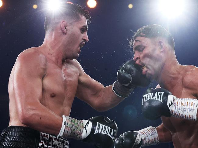 Issac Hardman (L) lands a punch on Rohan Murdoch’s chin. Picture: Mark Kolbe/Getty Images