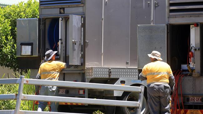 Energex workman bring in and set portable electrical transformers at Mount Tamborine after the widespread devastation. Picture: NCA NewsWire / Scott Powick