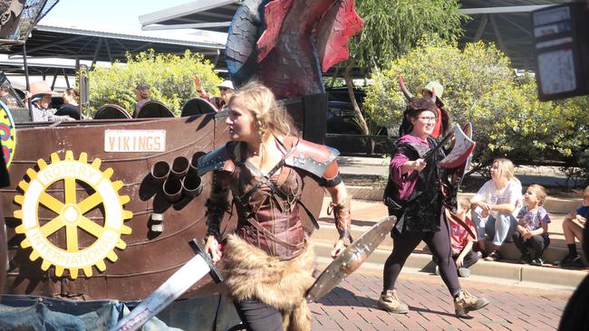 The Vikings ahead of their famous boat used in the annual Henley on Todd regatta.